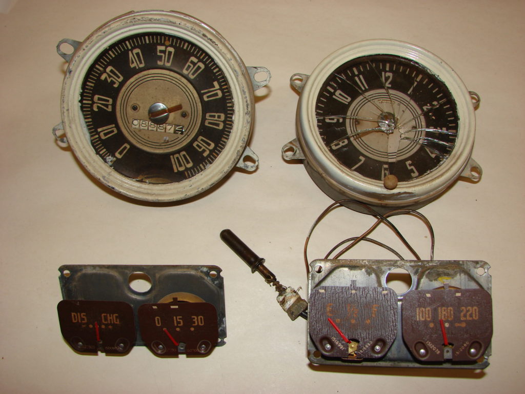 Old and cracked speedometers and other car parts