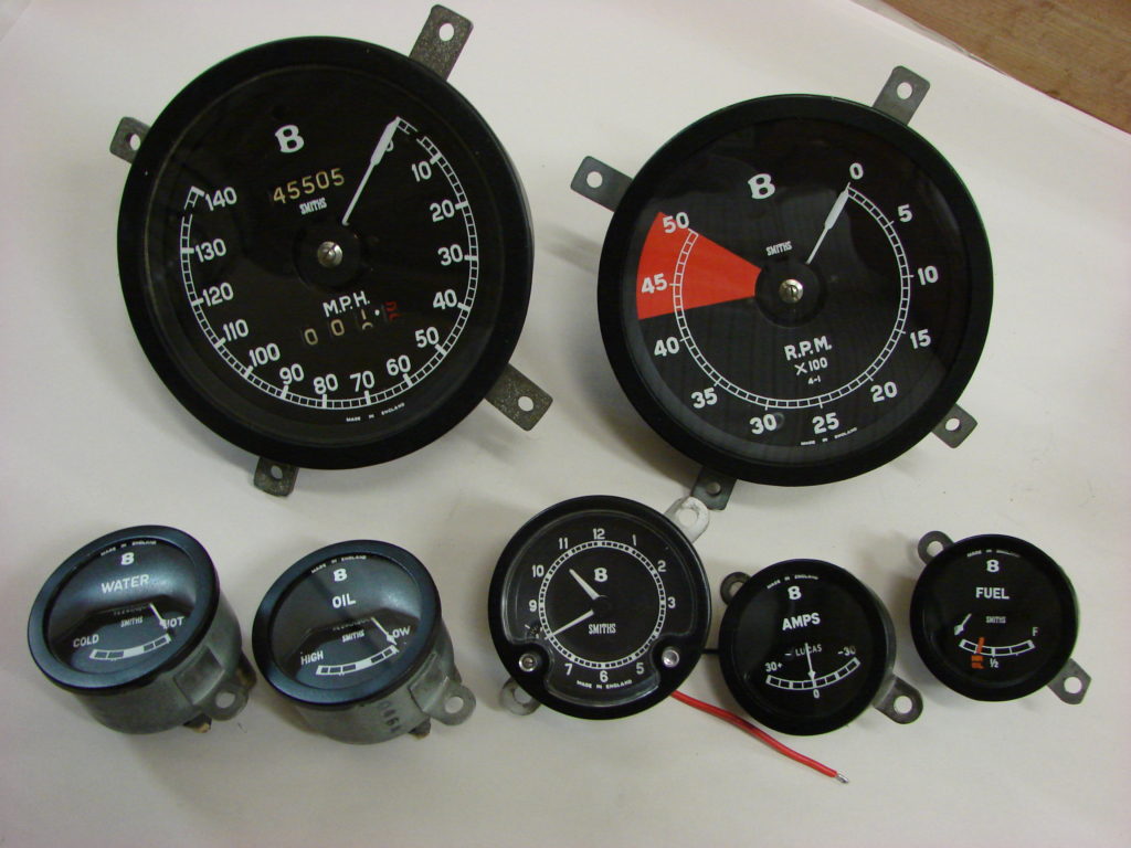 Two larger speedometers and five smaller instruments
