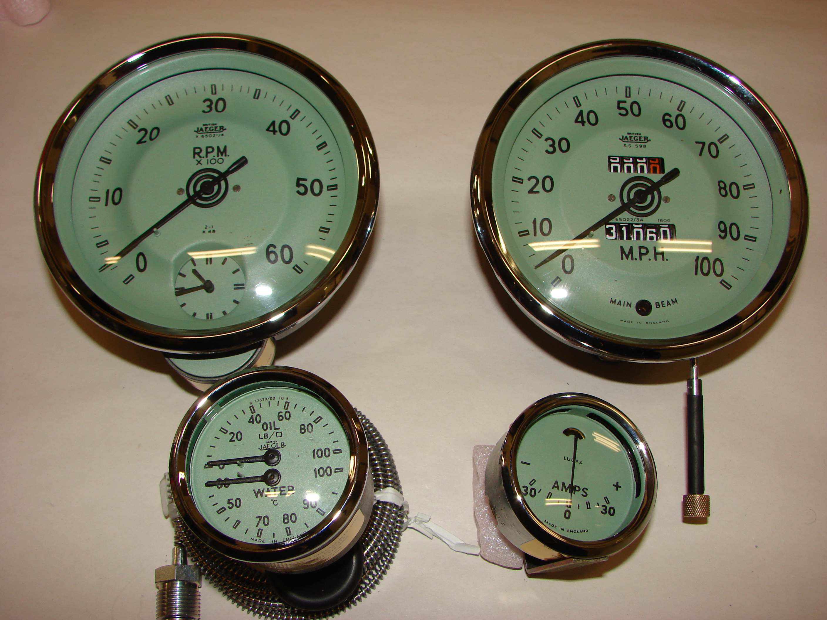 Two large speedometers and two smaller instruments