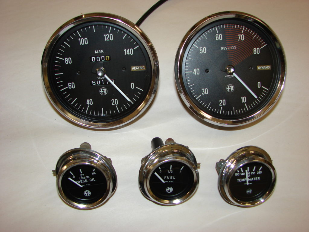 Two large speedometers and three smaller devices